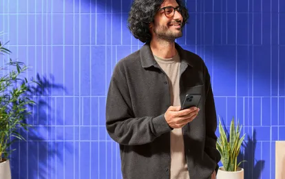 Person checking a cryptocurrency app on a smartphone